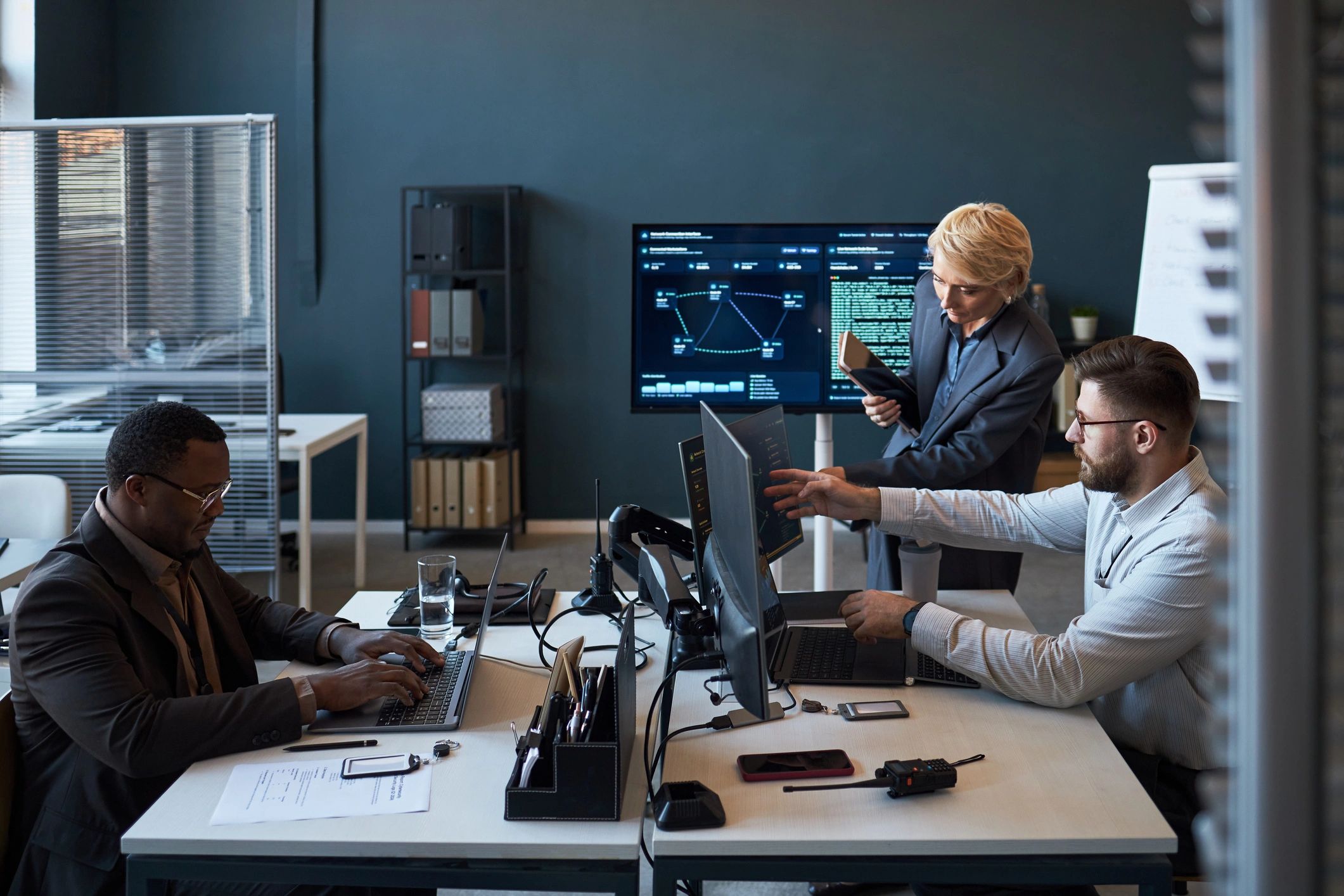 Business team reviewing AI and cybersecurity data